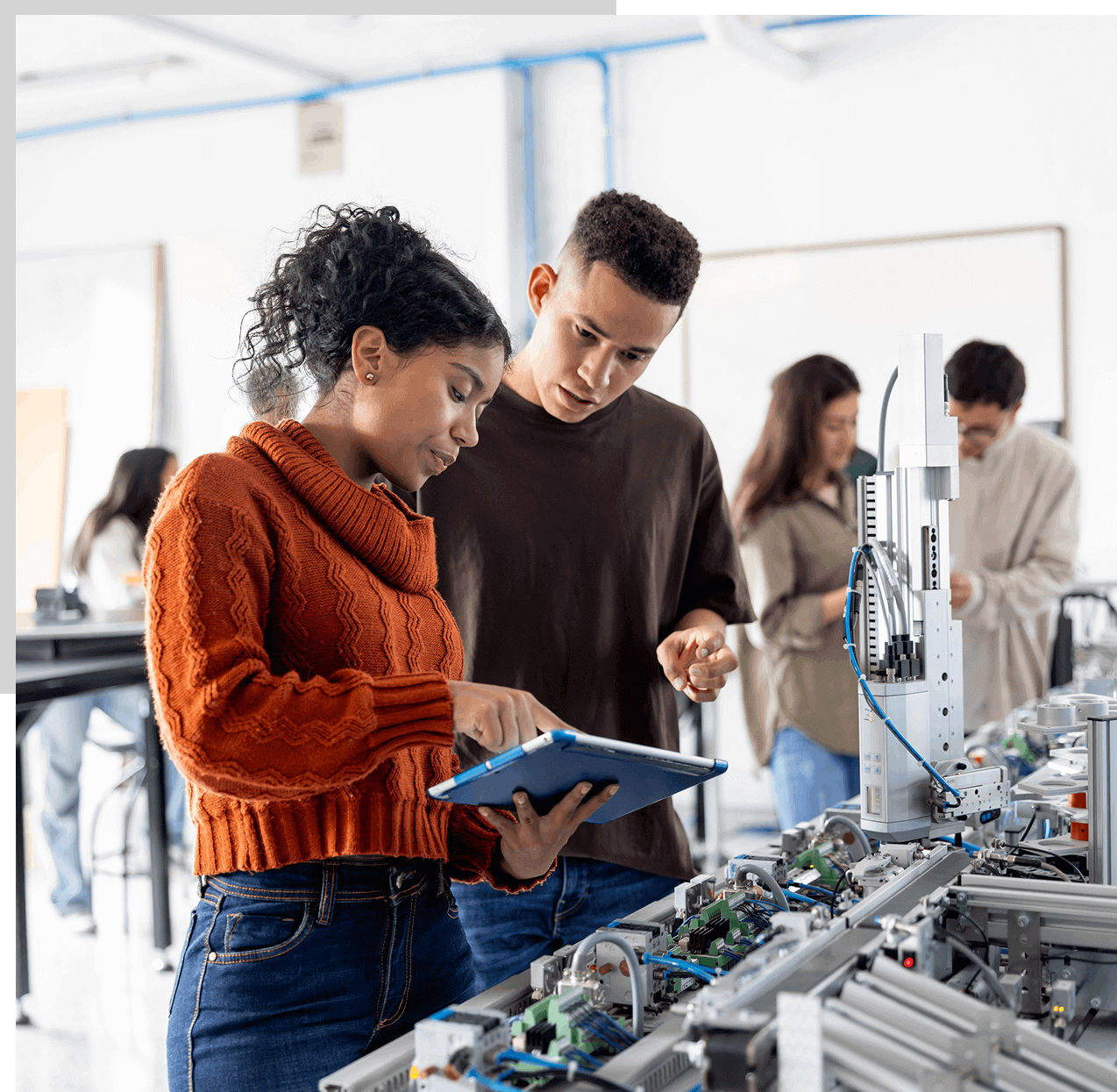 Two engineers discussing a project in a modern lab.